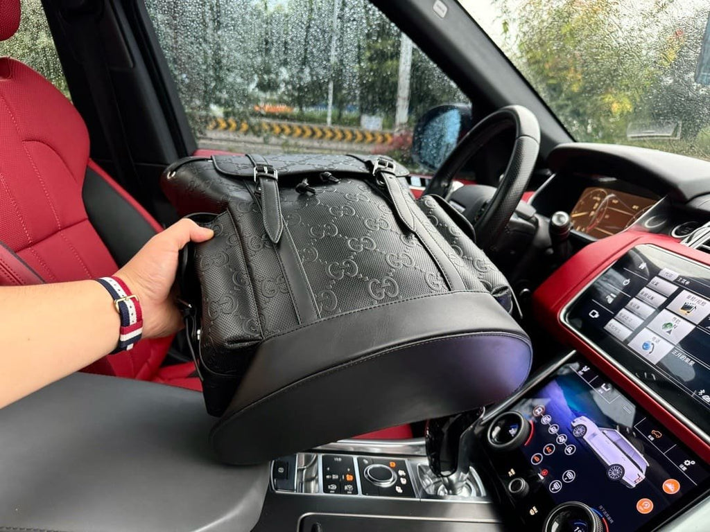 Gucci GG Leather Logo Embossed Backpack